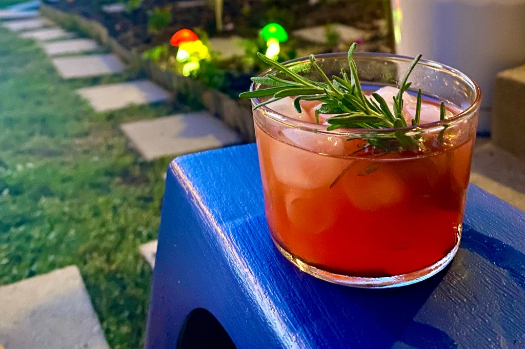 Negroni cocktail with honey and rosemary